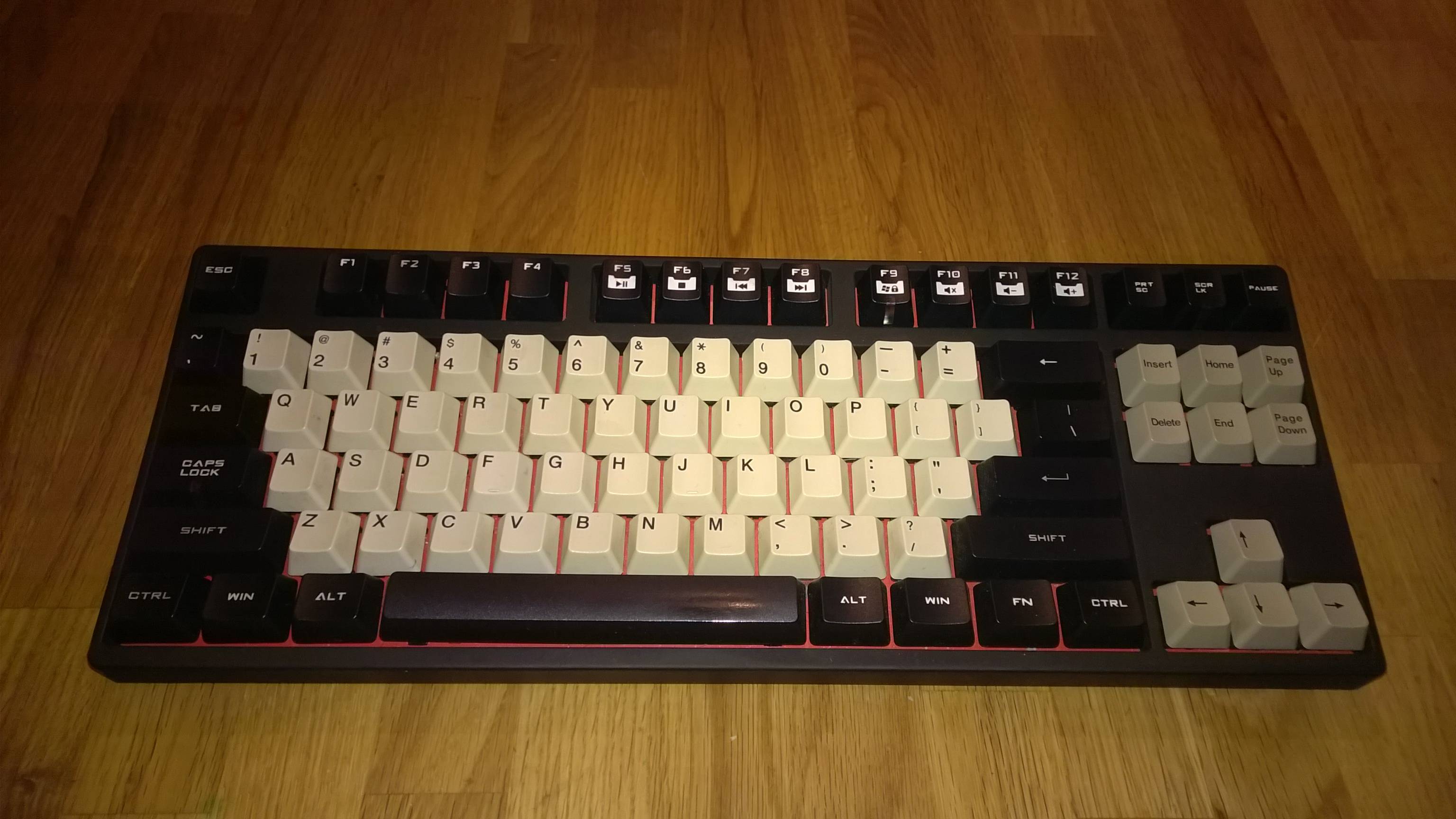 A photo of a CM Storm Quickfire RED TKL keyboard with a vignette applied